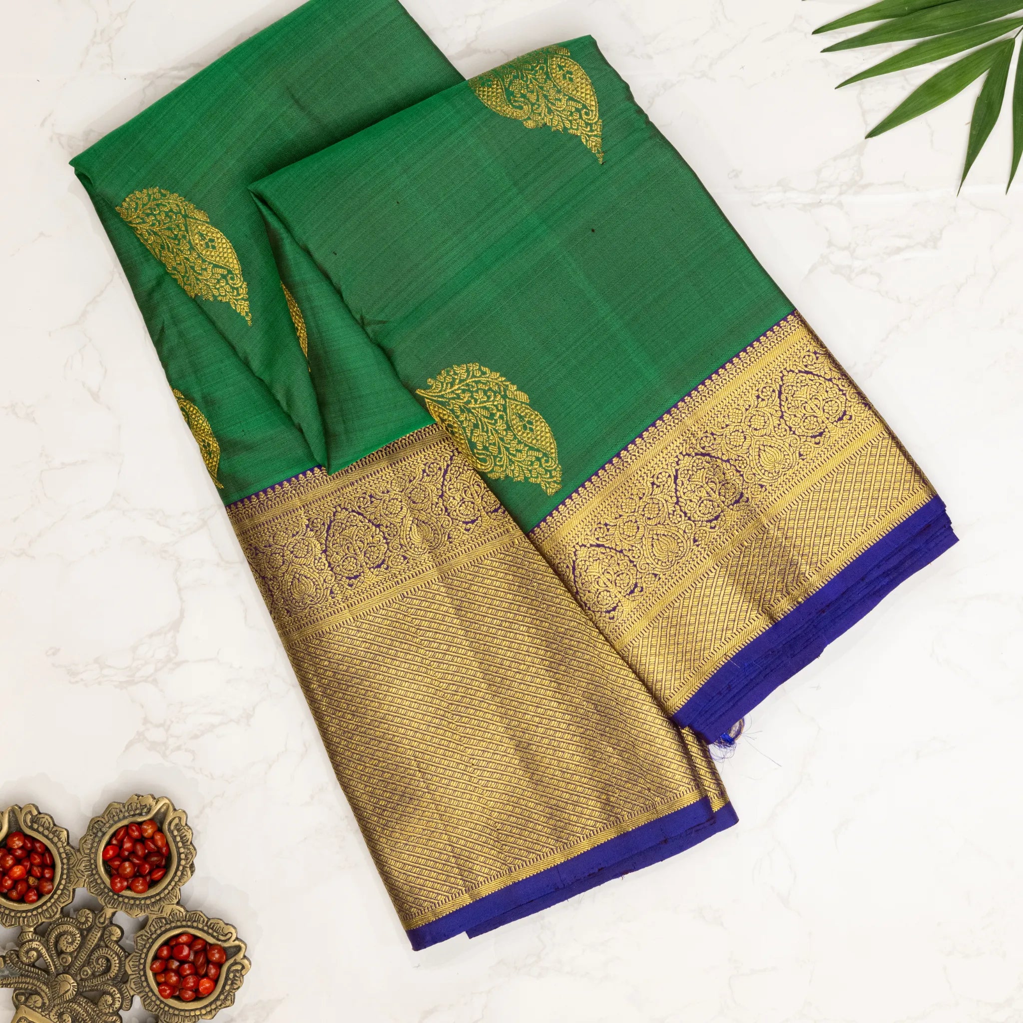 Emerald Green Kanchipuram Silk Saree – Gold Paisley Buttas with Royal Blue Zari Border