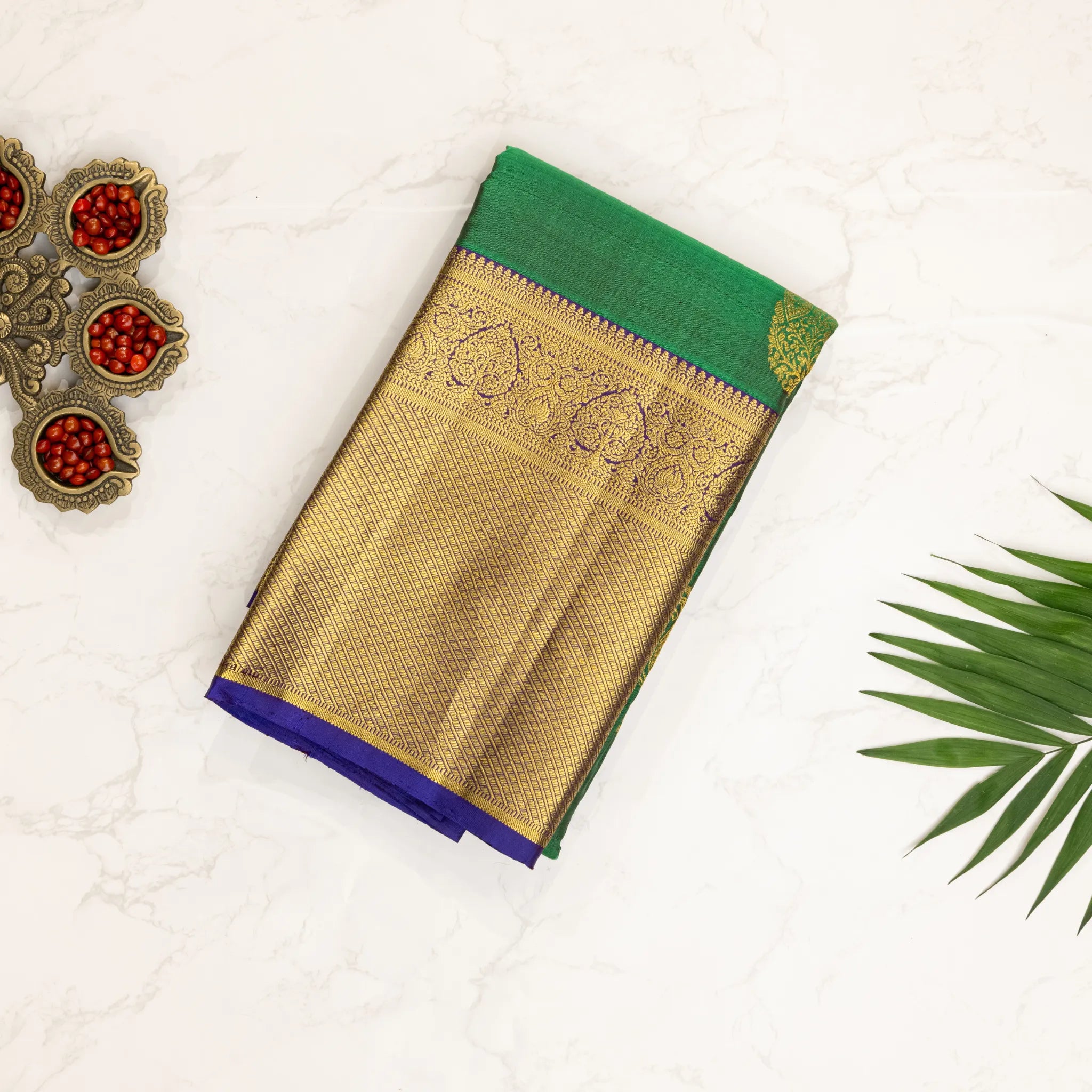 Emerald Green Kanchipuram Silk Saree – Gold Paisley Buttas with Royal Blue Zari Border