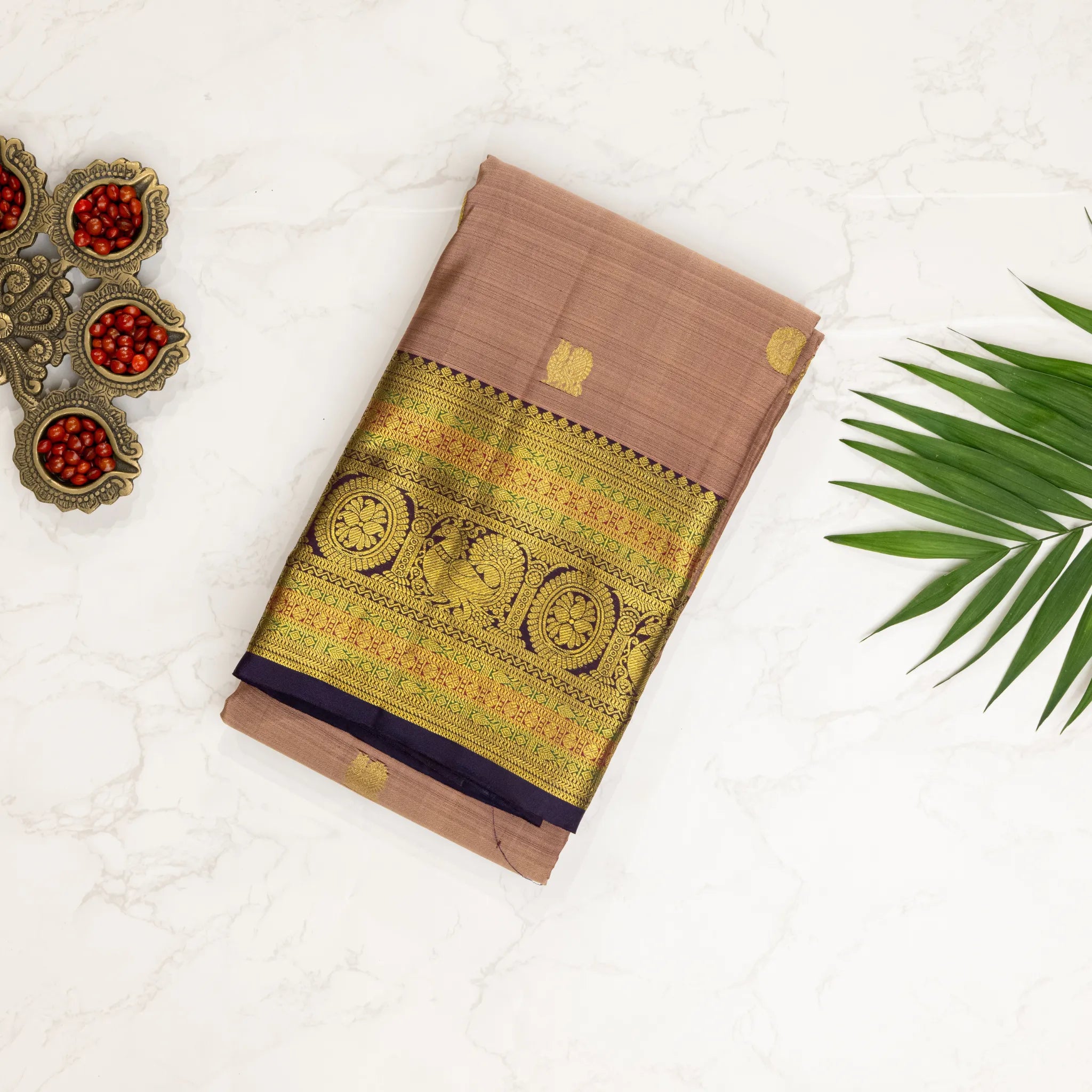 Dusty Beige Kanchipuram Silk Saree – Gold Zari Buttas with Traditional Peacock Border